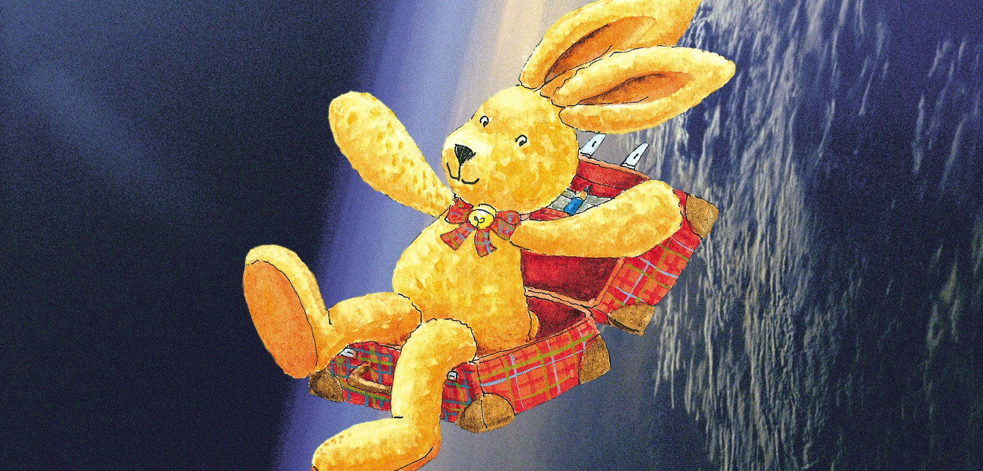 Der Hase Felix sitzend in einem Koffer.