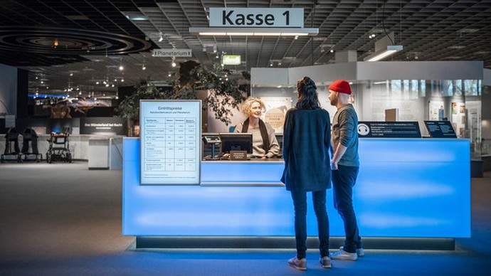 Visitors at the museum's ticket office.